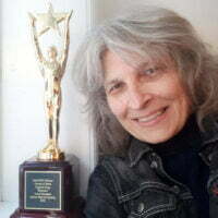 Anna with the Original Song Award of Merit from The IndieFEST Film Awards. Photo taken by Wanda Tse.